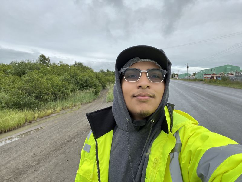 Chel in a hi vis jacket on an Alaska road