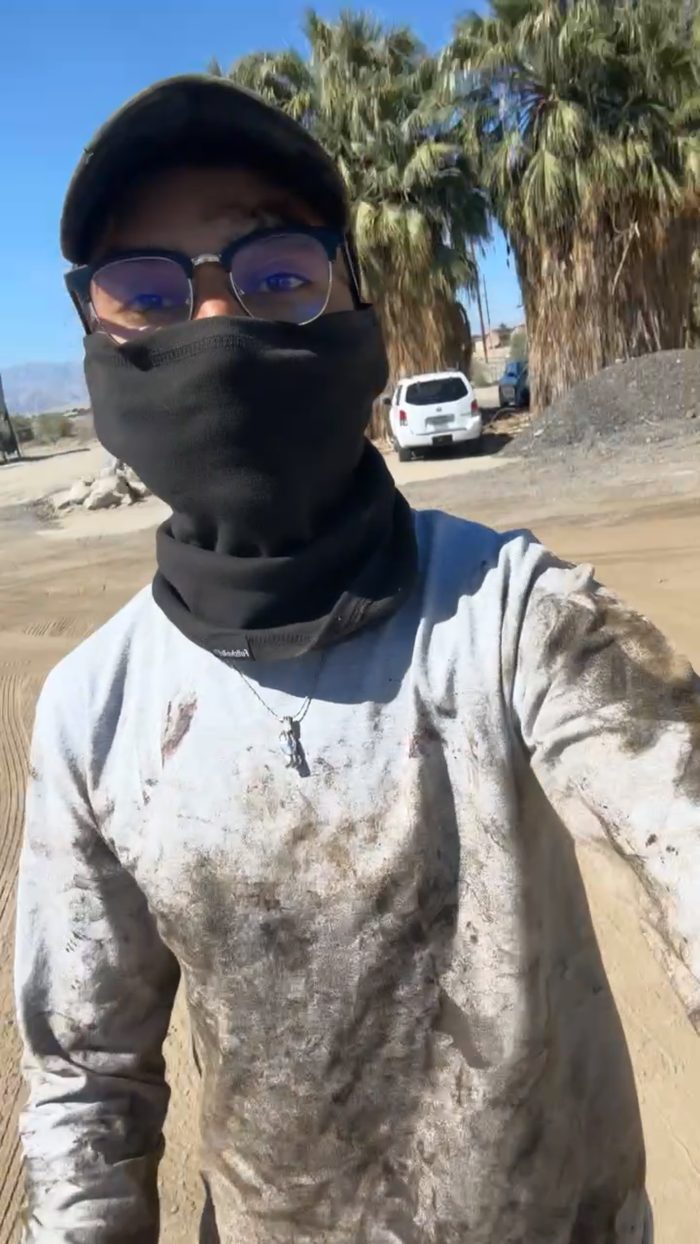 Chel covered in dust after a shift on a job site